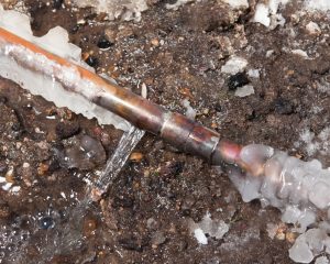 Frozen copper pipe with ice buildup and water leakage In Duncanville.